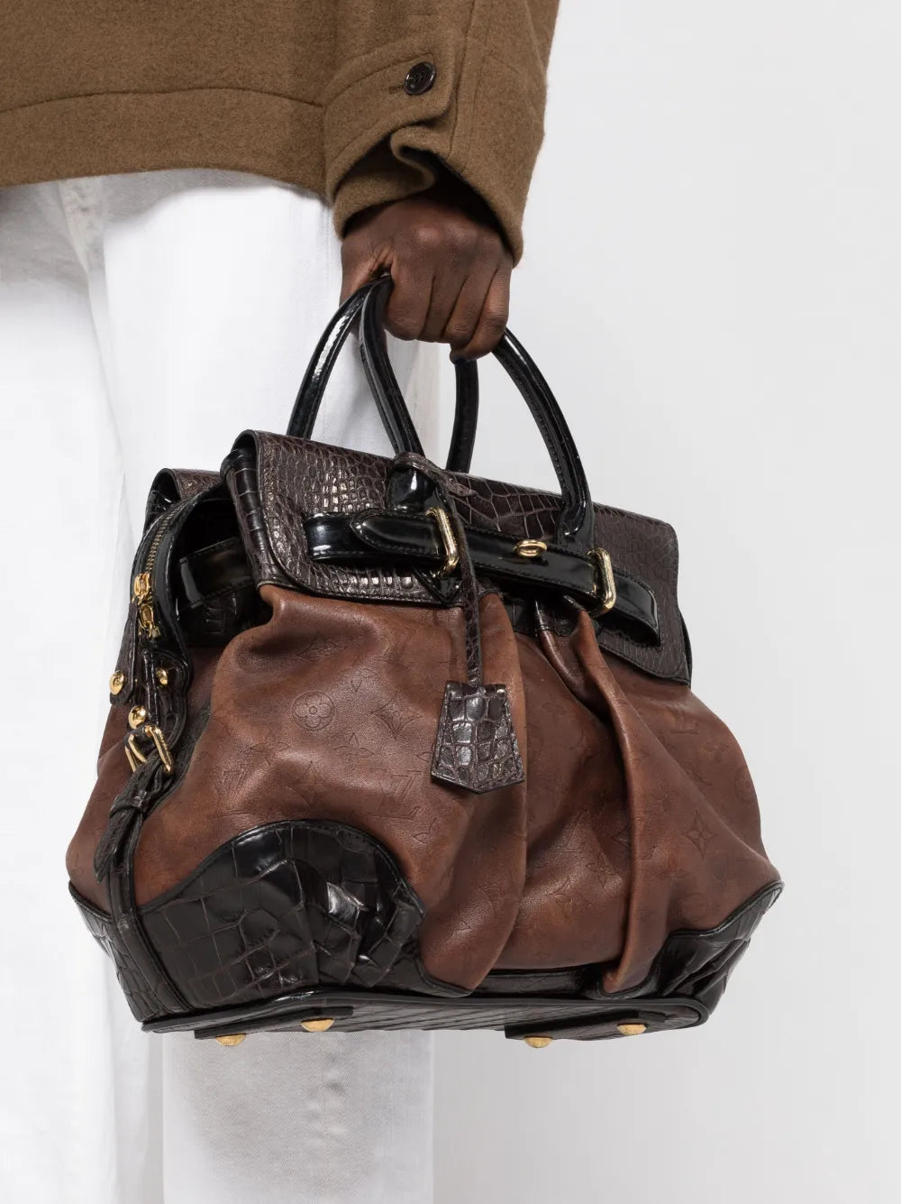 Pre-OwnedLouis Vuitton Pre-OwnedMonogram Debossed box-pleat detail panelled handbag